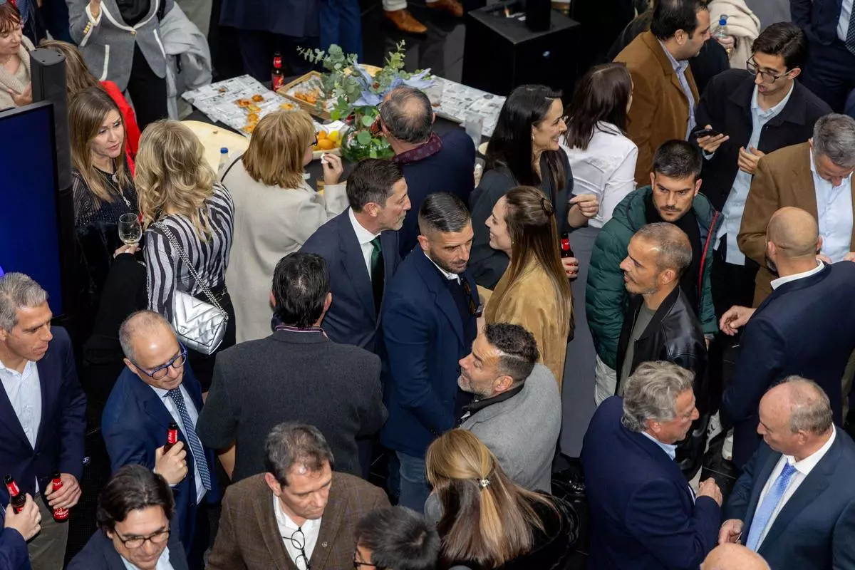 Attendees networking at an industry reception